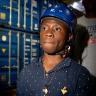Person wearing a helmet, container in the background