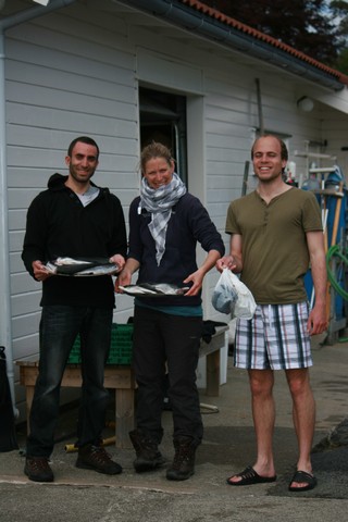 Some members from the fishing and preparation team. With their proud catch! Photo by Serra Orey 
