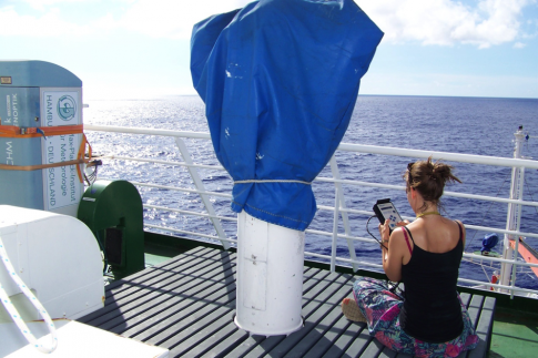 Fig.1: It’s forbidden to shake! Realization of aerosol measurements with a sun photometer on the RV Meteor. / Abb.1: Wackeln verboten! Durchführung der Aerosolmessung mit dem Sonnenphotometer auf dem Forschungsschiff Meteor (Foto: A. Raeke).