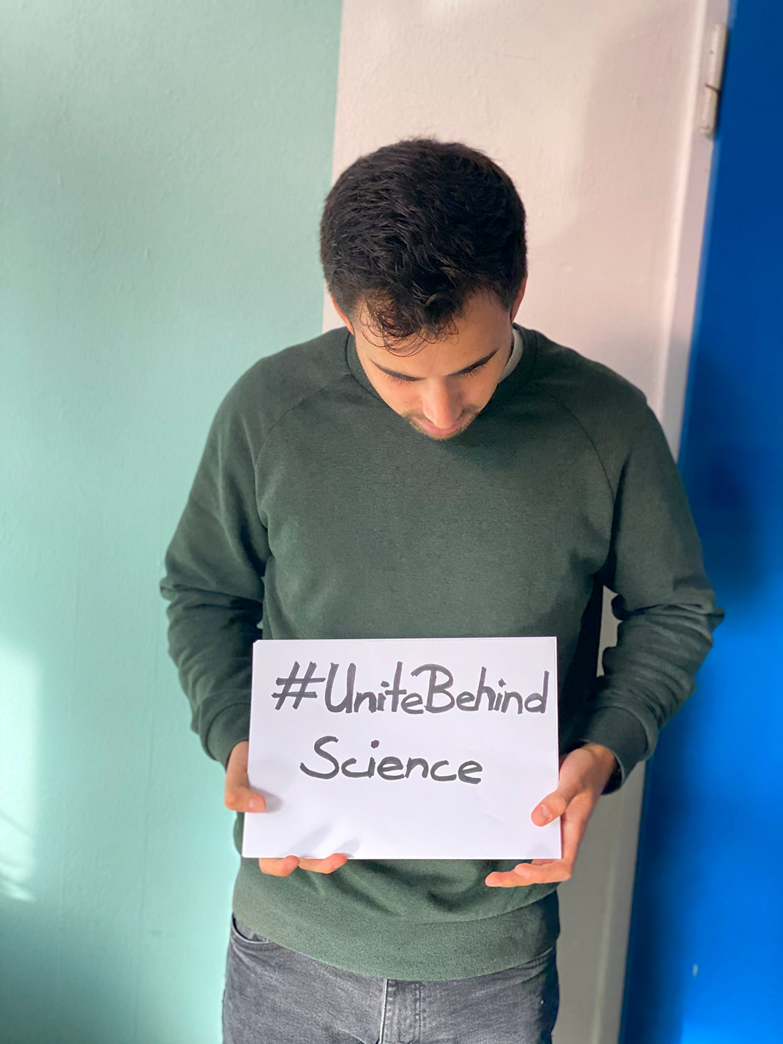 Joaquin holding a climate sign