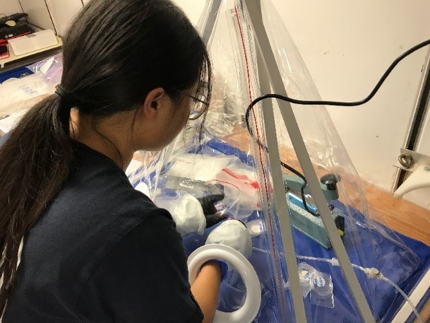 Photo 4: Trying to seal PES filters for synchrotron analyses in the Glove bag purged with Nitrogen is also a fun experience (Photo Z Zhang)