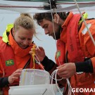Henni and Micha check a herring egg incubator at a mesocosm. Photo: Maike Nicolai, GEOMAR