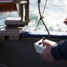 Rudi is operating winch with the cable o the microstructure. Rudi bedient die Winde mit dem Kabel der Mirkostruktur. (Credit: Lisa Hoffmann, CC BY-NC-ND)